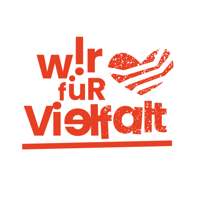 Das Logo zeigt den roten Schriftzug "Wir für Vielfalt" auf weißem Grund mit einem Herz daneben.